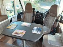 Table with swivel Captain chairs