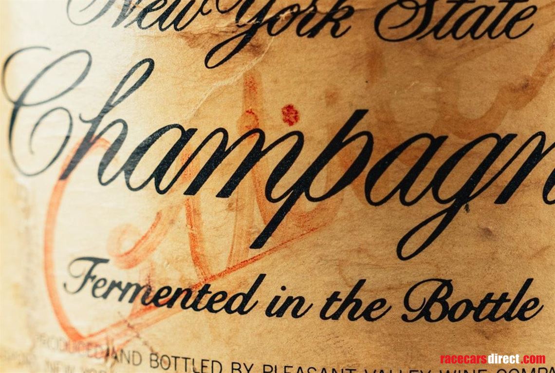 gilles-villeneuve-singed-bottle