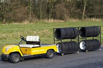 pitpaddock-car-with-tyre-trolleys