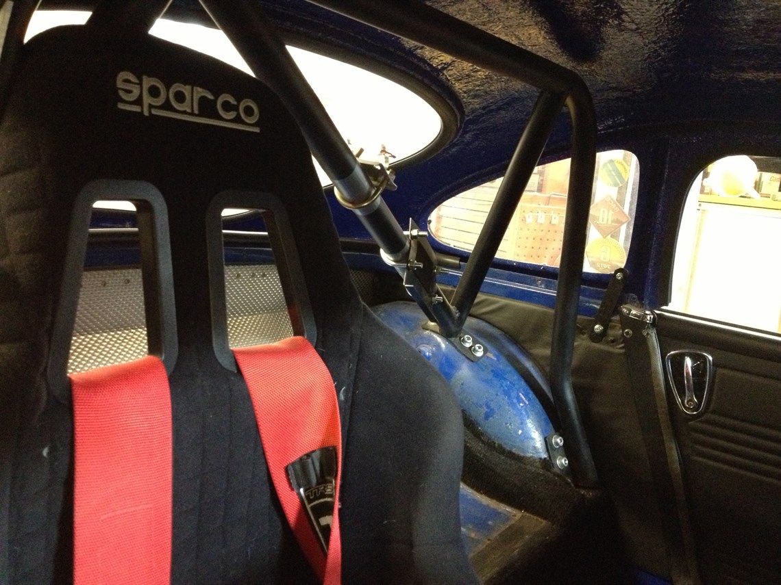 Roll cage shoulder harness and race seats